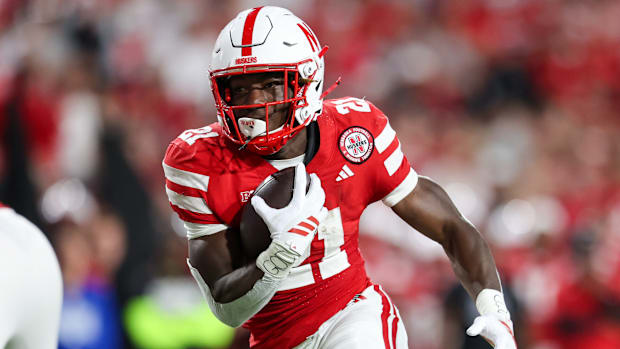 Nebraska running back Emmett Johnson scores his third touchdown against Akron on a six-yard run.