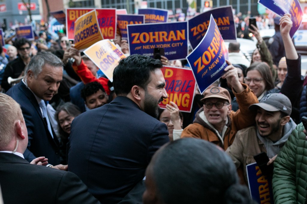 Democratic mayoral nominee Zohran Mamdani greets supporters outside LaGuardia College in Queens ahead of the final debate