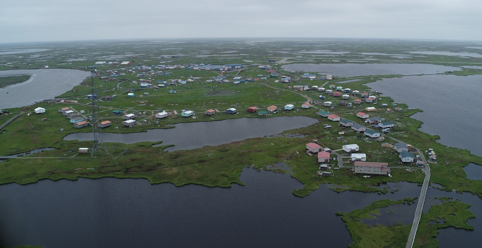 A photo of Kipnuk showing how low lying and close to the water it is.