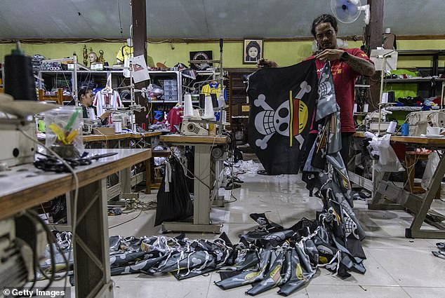 A T-shirt workshop knocking out orders for the anime Jolly Roger symbol in Central Java, Indonesia