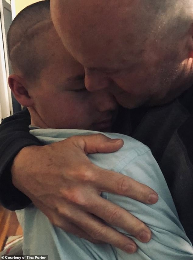 Jeff Huber, Brody's father, is pictured above hugging him. Brody died of DMG on March 8, 2021, at 14 years old