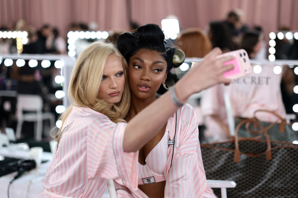 Alex Consani and Angel Reese get glammed up backstage before the Victoria's Secret Fashion Show
