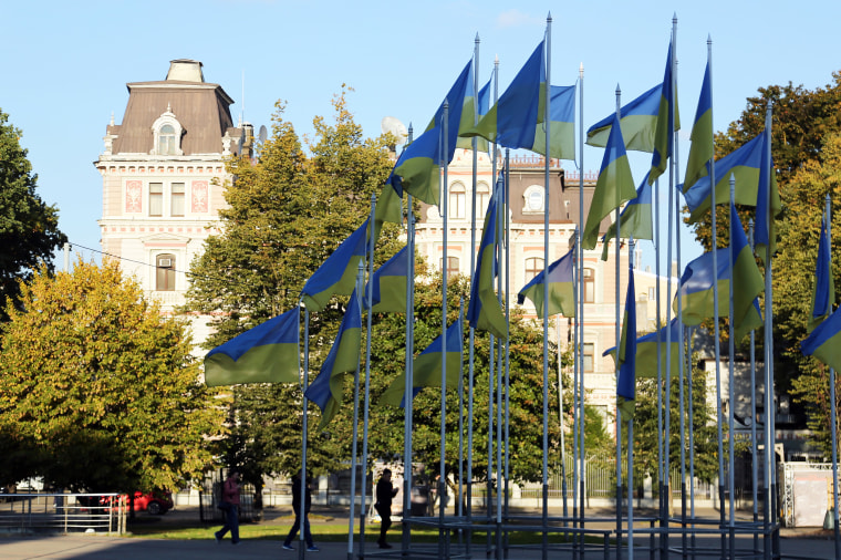 Ukrainian flags fly outside the Russian Embassy in Riga, Latvia.