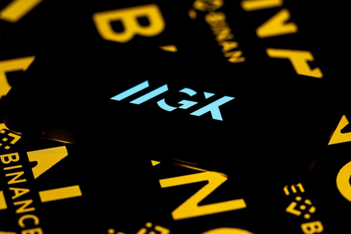 ANKARA, TURKIYE - MARCH 24: In this photo illustration 'MGX' logo is displayed on a mobile phone screen in front of a screen displaying 'Binance' logo in Ankara, Turkiye on March 24, 2025. (Photo by Didem Mente/Anadolu via Getty Images)