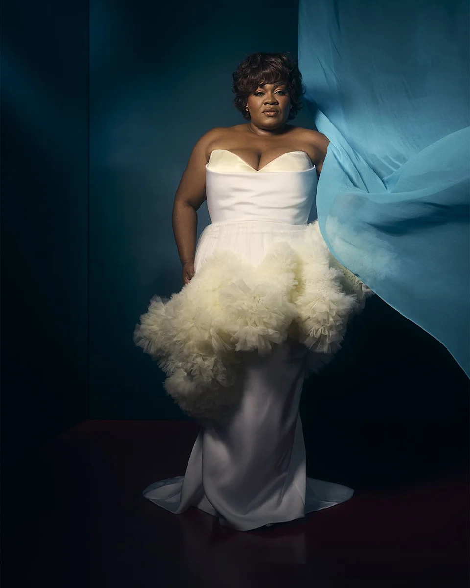 stylish gown with a voluminous skirt in a dramatic setting
