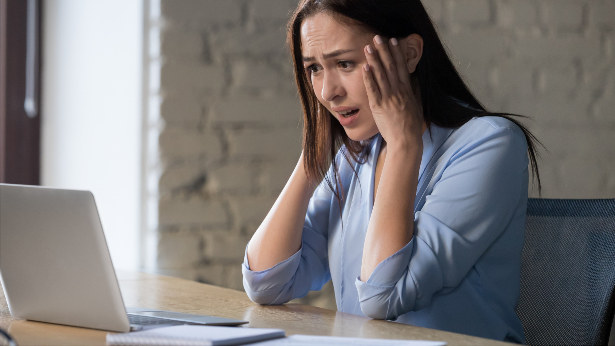 Shocked woman who was just hacked