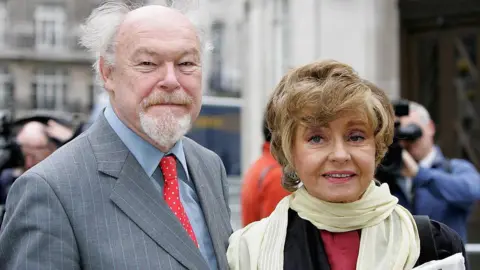 Getty Images Timothy West and Prunella Scales photographed in 2006.  They are smiling and looking to camera.  They are formally dressed.