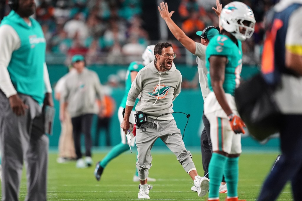 Dolphins coach Mike McDaniel on the sidelines during a game.