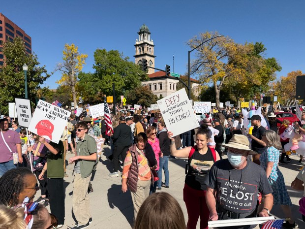 "No Kings" demonstrators march through downtown Colorado Springs between the Pioneer Museum and the U.S. Olympic & Paralympic Museum on Saturday, Oct. 18, 2025. (Photo by Bruce Finley / The Denver Post)