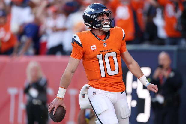 Bo Nix #10 of the Denver Broncos celebrates after scoring a rushing touchdown in the fourth quarter of a game against the New York Giants at Empower Field At Mile High on Oct. 19, 2025 in Denver. (Photo by Matthew Stockman/Getty Images)