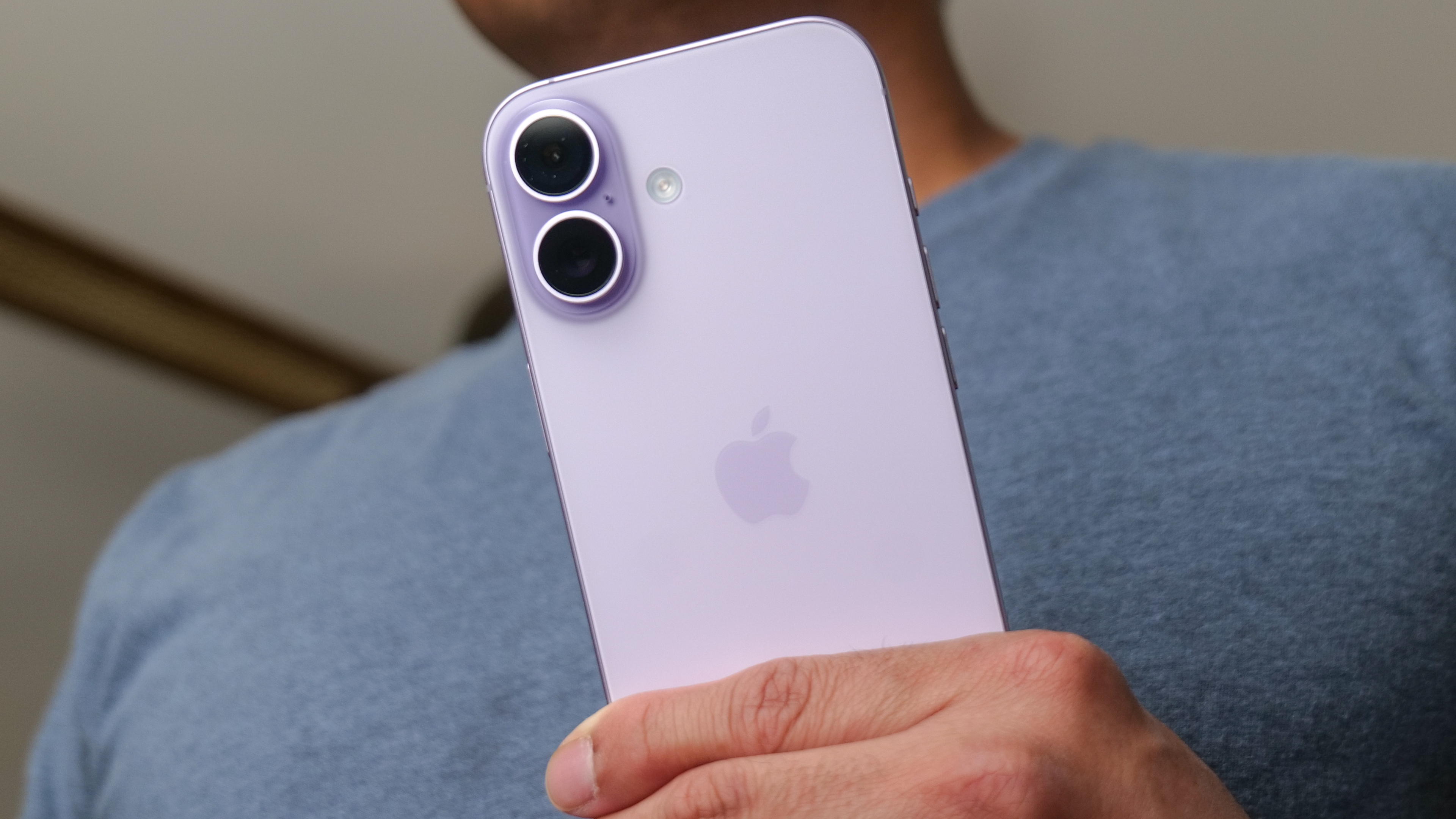 Apple iPhone 17 held in the hand.
