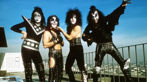 Getty Images The KISS members pose on a rooftop in LA dressed in leather. From left to right they are Ace Frehley, Paul Stanley, Peter Criss, and Gene Simmons.