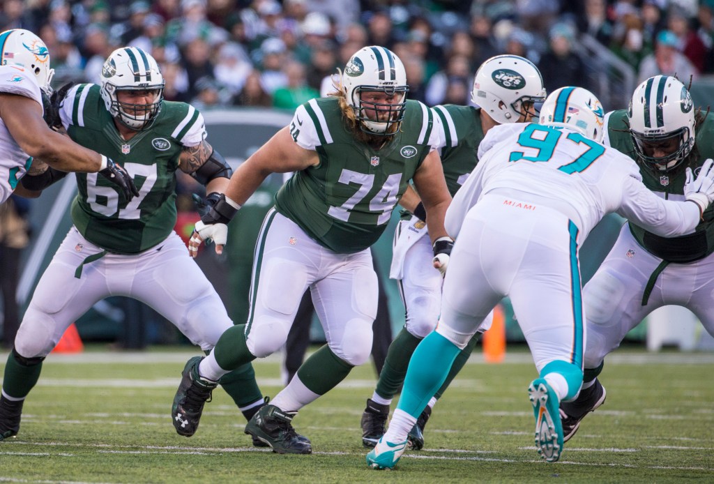 Center Nick Mangold #74 of the New York Jets rushes the pocket during a football game against the Miami Dolphins.