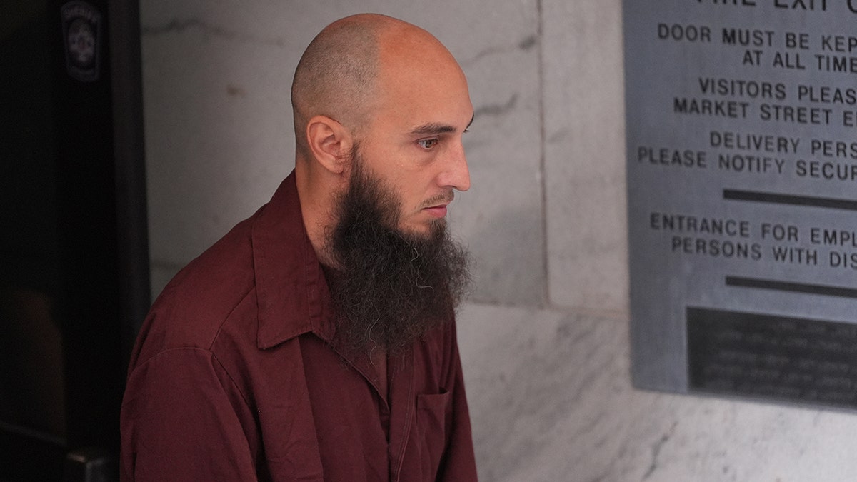 Cody Balmer walking out of courthouse
