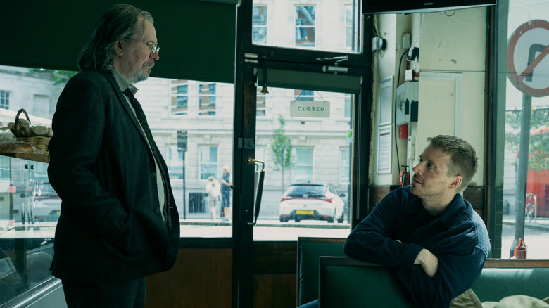Jackson Lamb (Gary Oldman) talking to River (Jack Lowden) in a diner in Slow Horses