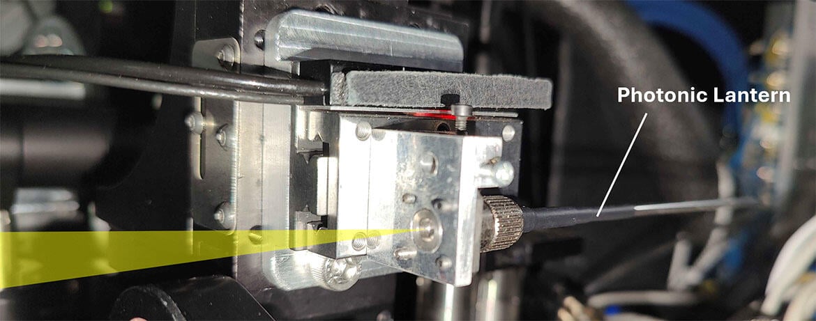 Theh photonic lantern, a specially designed optical fibre, mounted on the FIRST-PL instrument at the Subaru Telescope. The yellow triangle indicates the path of the light entering the lantern. (Credit: Sébastien Vievard/University of Hawaii)