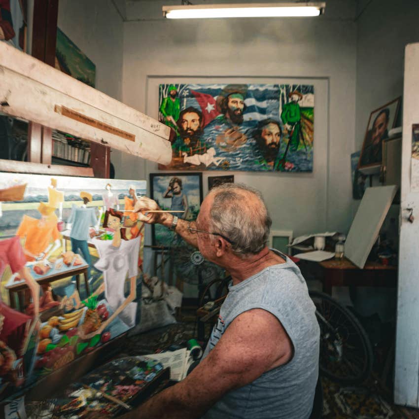 man painting a picture