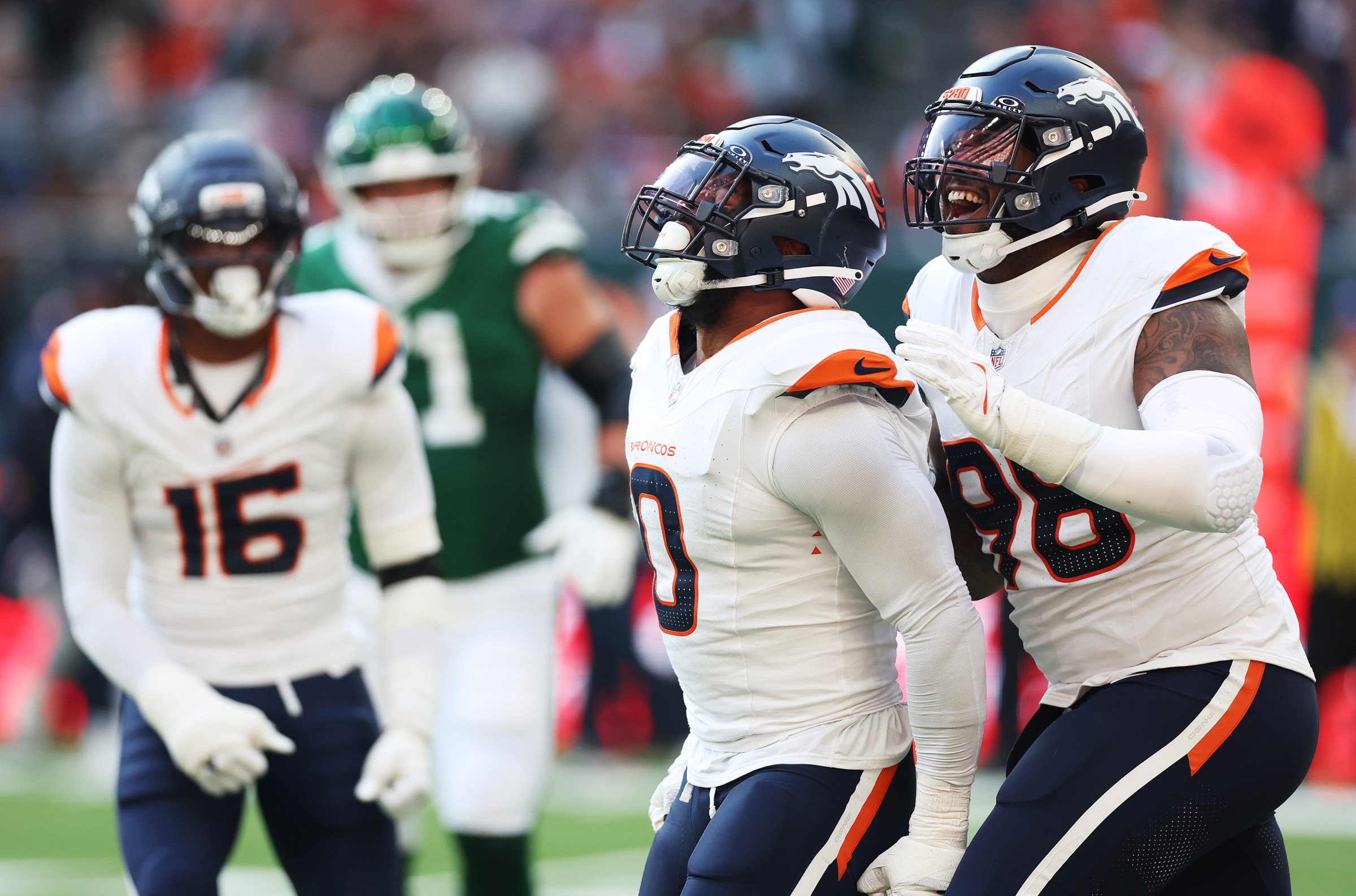 LONDON, ENGLAND - OCTOBER 12: Jonathon Cooper and John Franklin-Myers of Denver Broncos celebrate during the NFL 2025 game between Denver Broncos and New York Jets at Tottenham Hotspur Stadium on October 12, 2025 in London, England. (Photo by Harry Murphy/Getty Images)