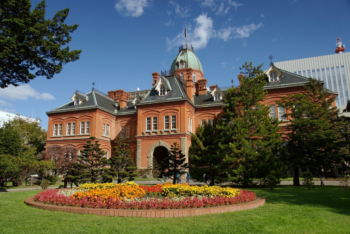 Real-world photo of the Hokkaid&omacr; Government Office, a large, red-brick building with slate roof.