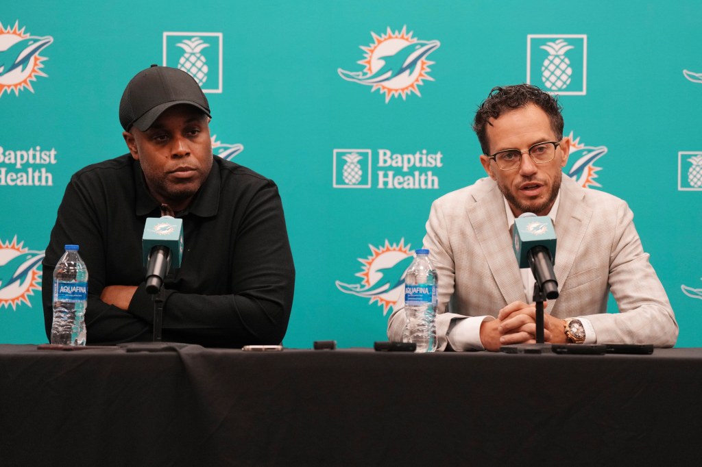 Miami Dolphins general manager Chris Grier and head coach Mike McDaniel take questions during a news conference.