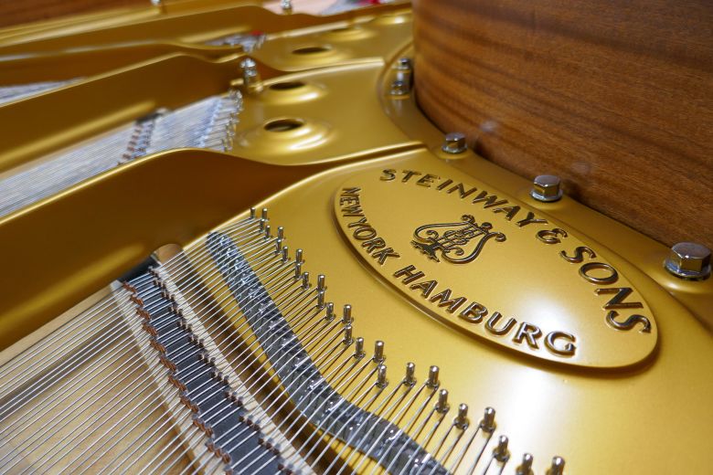 The Steinway & Sons logo inside a piano frame at the company's factory in Queens, New York, on September 4, 2025.