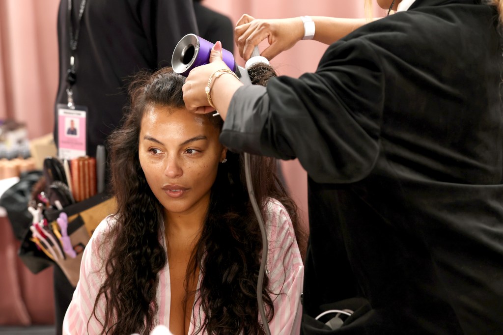 Paloma Elsesser gets glammed up backstage before the Victoria's Secret Fashion Show