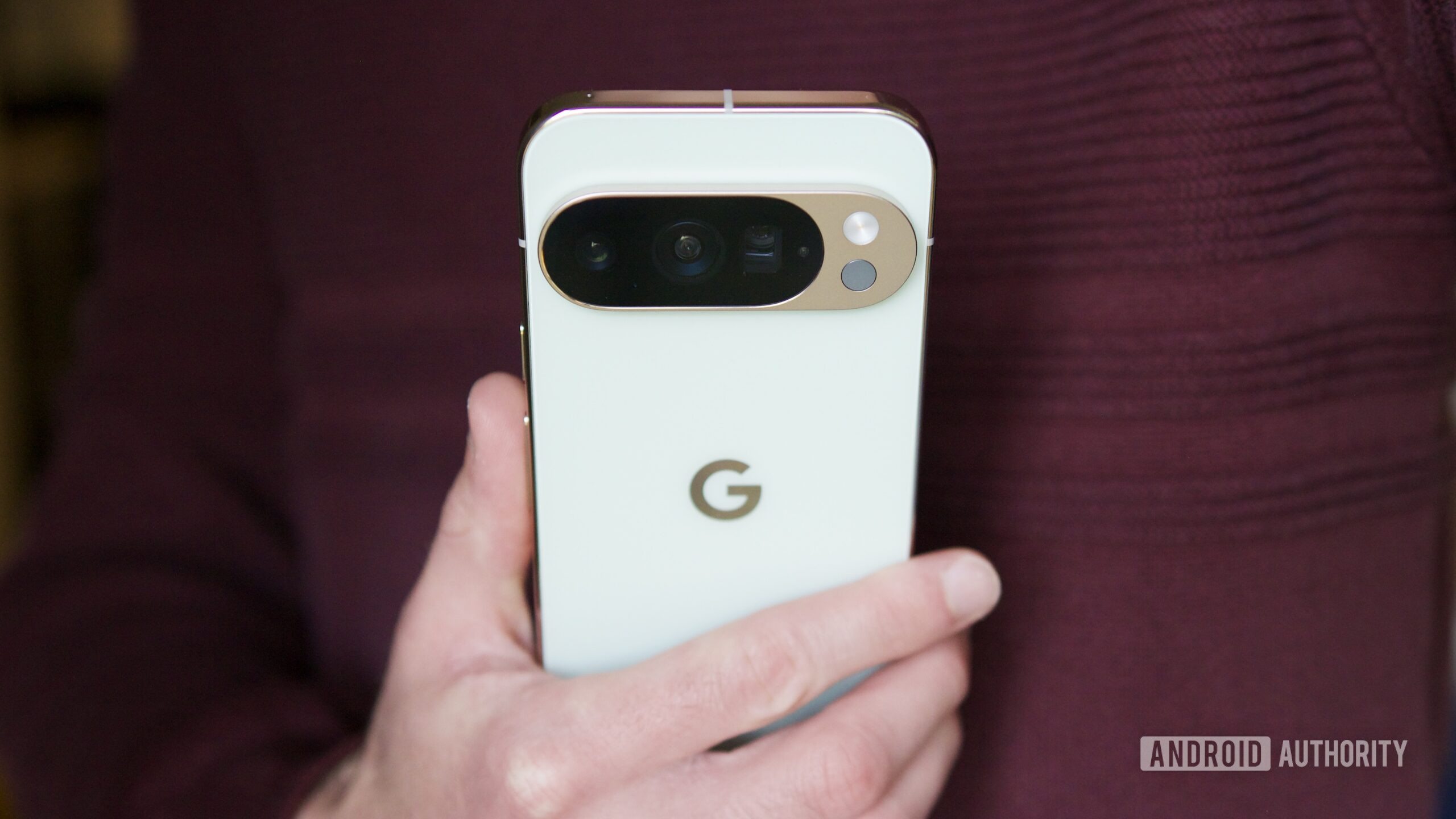 pixel 10 pro holding back of phone hero 3 Someone holding the Pixel 10 Pro, showing the back of the phone.