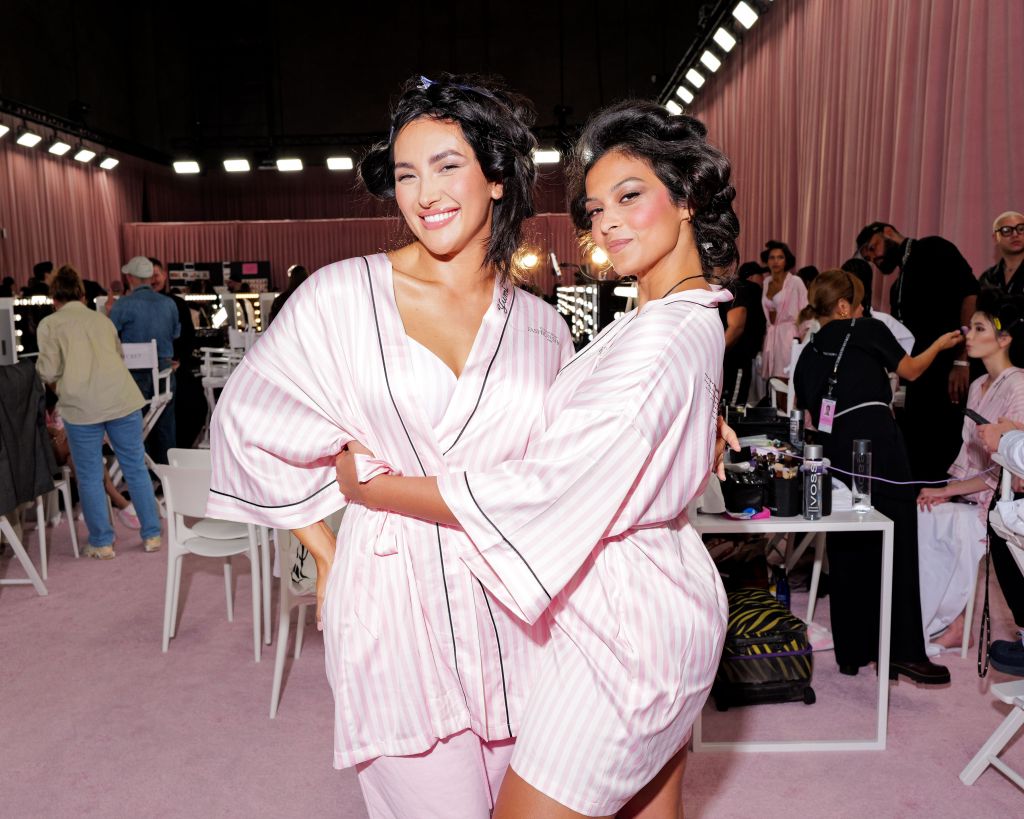 Yumi Nu and Devyn Garcia get glammed up backstage before the Victoria's Secret Fashion Show