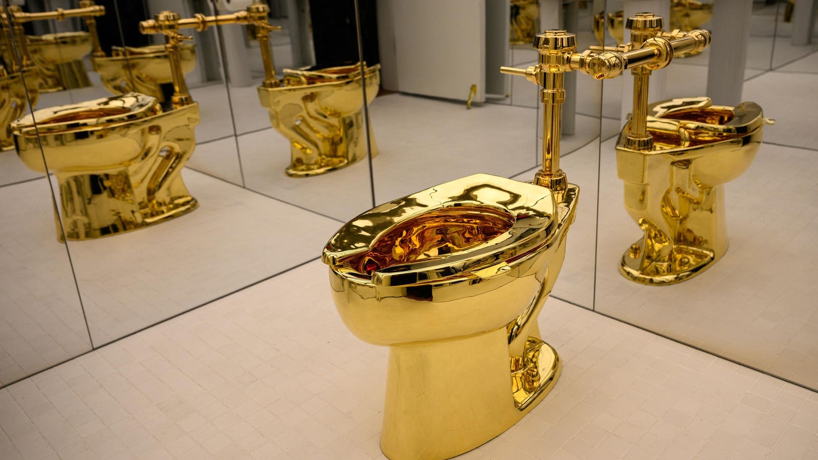  Famed Golden Toilet—With A Trump Connection— Fetches $12.1 million