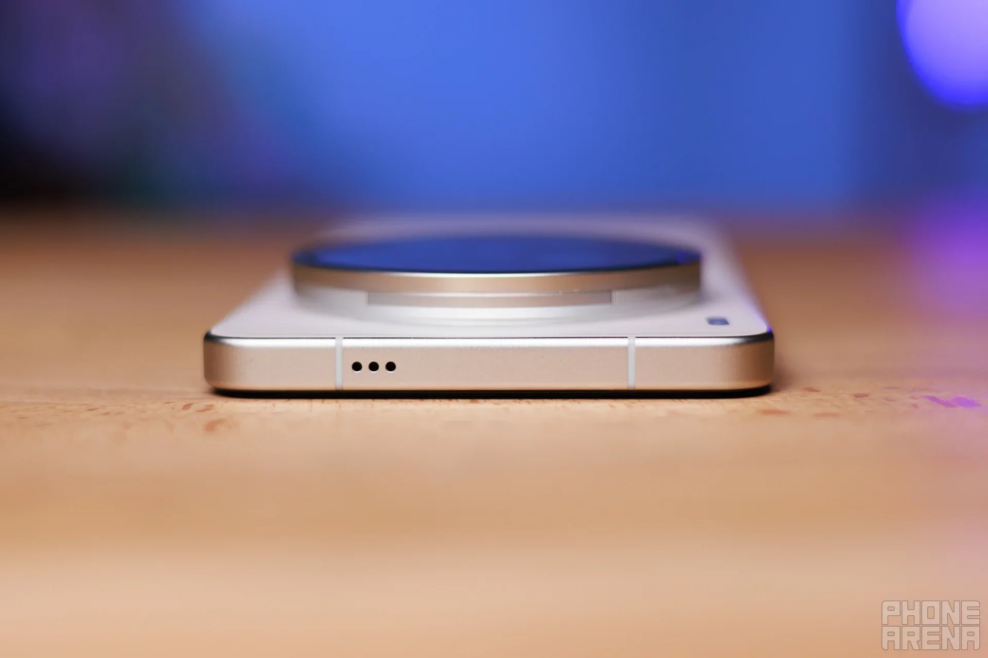 A white Vivo phone on a desk.