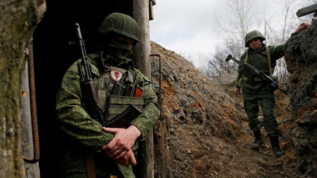 Photo: Militants of the self-proclaimed Luhansk People's Republic (LNR) stand guard at fighting positions on the line of separation from the Ukrainian armed forces in Luhansk Region, Ukraine April 13, 2021. Credit: REUTERS/Alexander Ermochenko