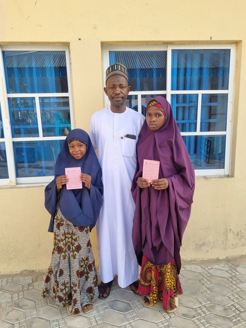 Maina Modu, shown with his daughters, said he mobilized everyone in his community to get HPV vaccines to people who need them.