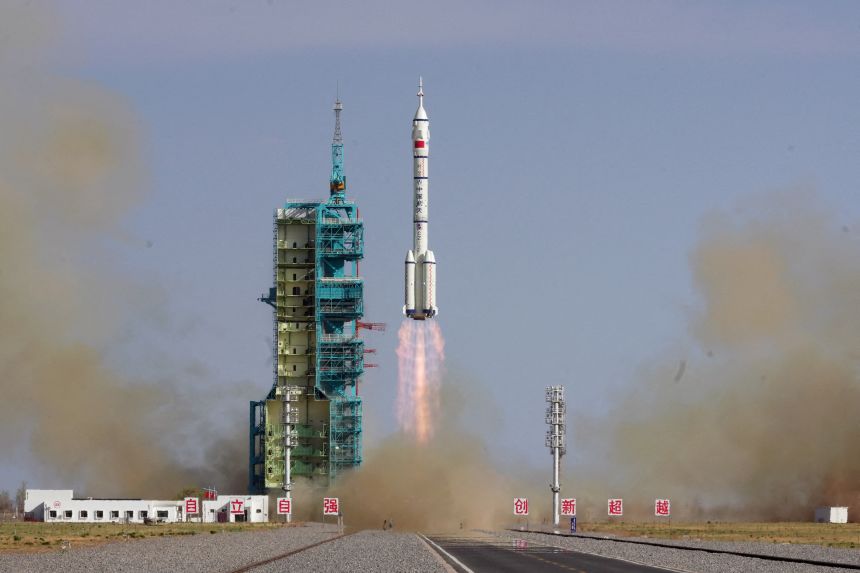 A Long March-2F rocket carrying the Shenzhou-20 spacecraft takes off from the Jiuquan Satellite Launch Center.