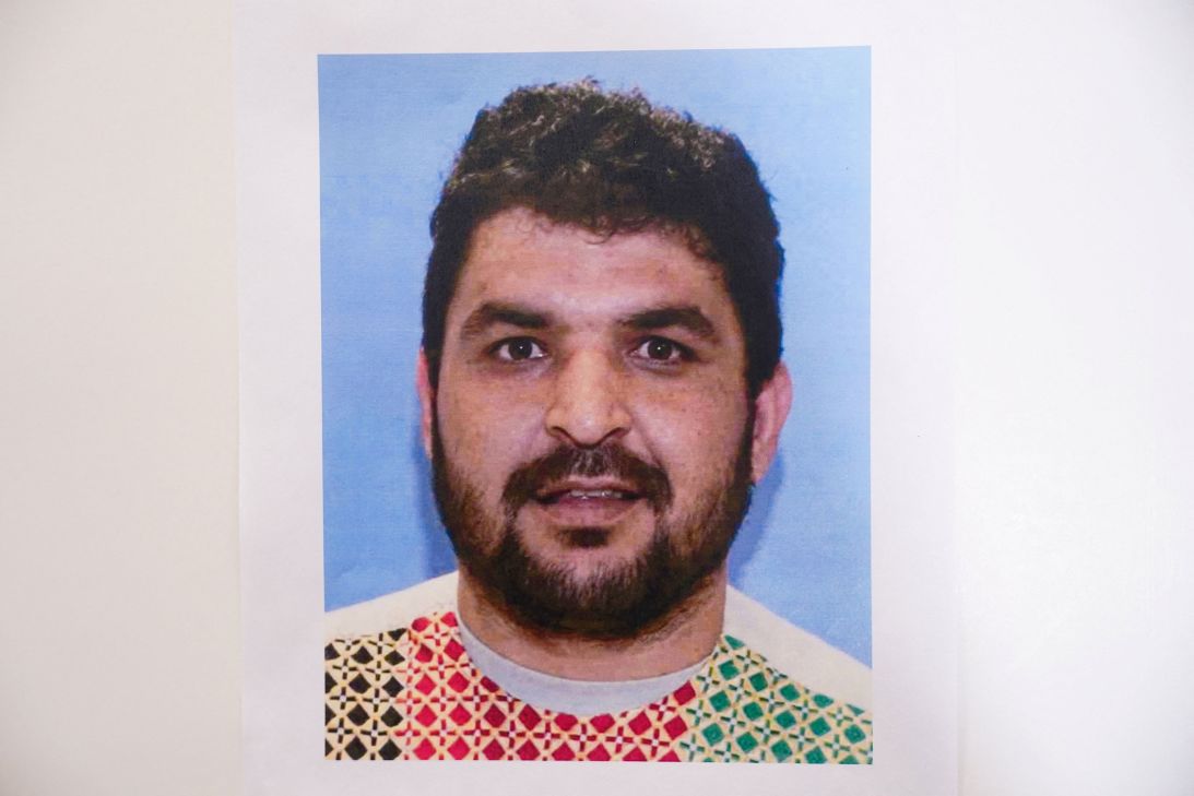 A picture of Rahmanullah Lakanwal, an Afghan national who is the suspect in the shooting of two National Guard members, is displayed at a press conference in Washington, DC, on November 27.