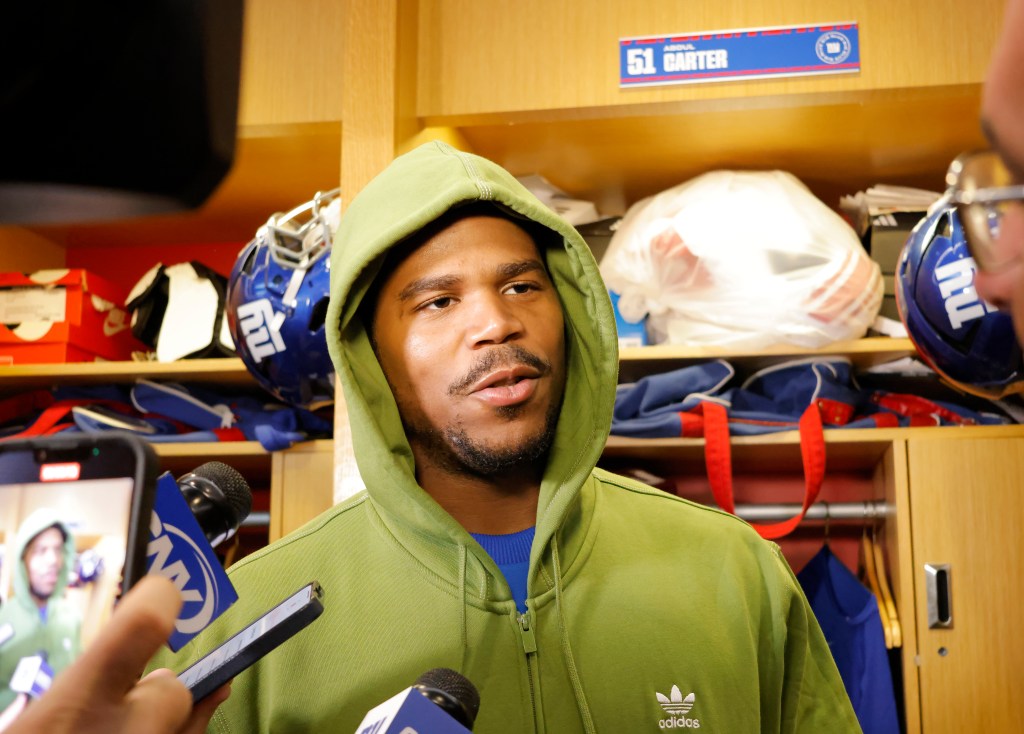 Abdul Carter speaks to reporters inside the locker room at the Giants practice facility last month.