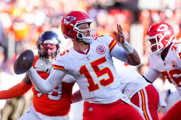 Patrick Mahomes stands in the pocket and attempts to throw the ball