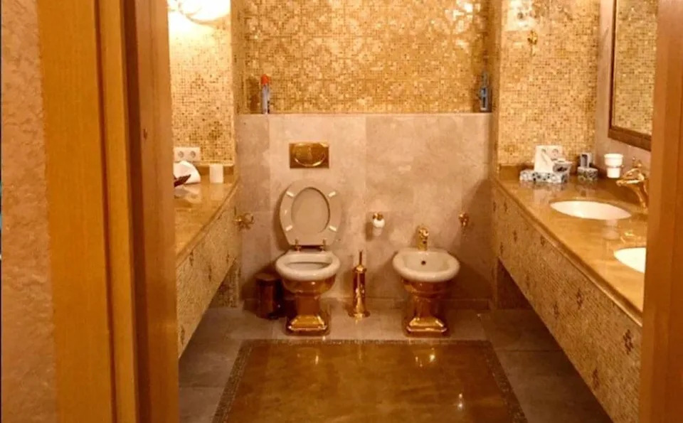 A golden toilet said to be from one of the bathrooms in the apartment of Zelenskyy's former business partner Timur Mindich, who has fled the country