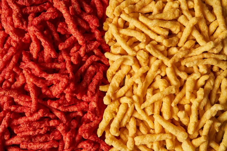 Cheetos Flamin’ Hot Crunchy, left, next to new Simply NKD Cheetos Flamin’ Hot Crunchy.