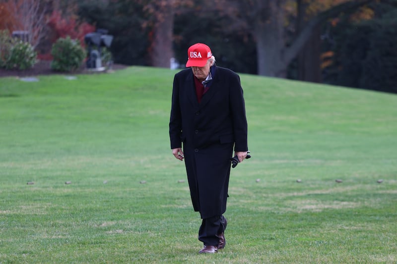 US President Donald Trump walks from Marine One to the White House after landing on the South Lawn.