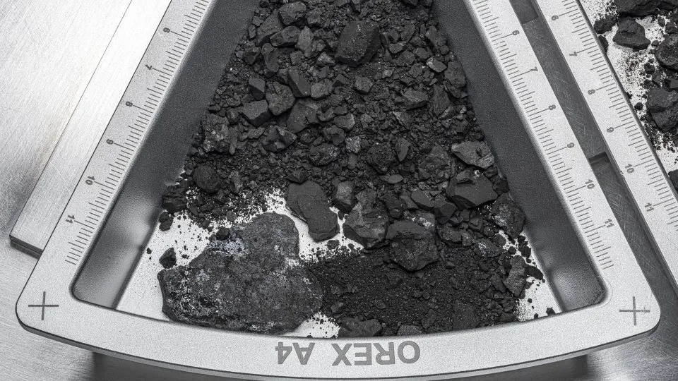 A container holding rocks and dust from asteroid Bennu. - Erika Blumenfeld and Joseph Aebersold/NASA