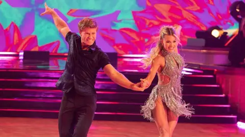 Getty Images Robert Irwin dancing on stsage together with his partner Witney Carson