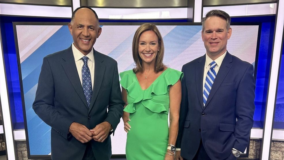 Mark Spain with his longtime anchor partners, Danner Evans and George Flickinger.