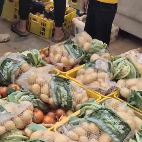 Hossam al-Astal Screengrab of WhatsApp video from Gaza militia leader Hossam al-Astal showing boxes of fresh vegetables in Gaza