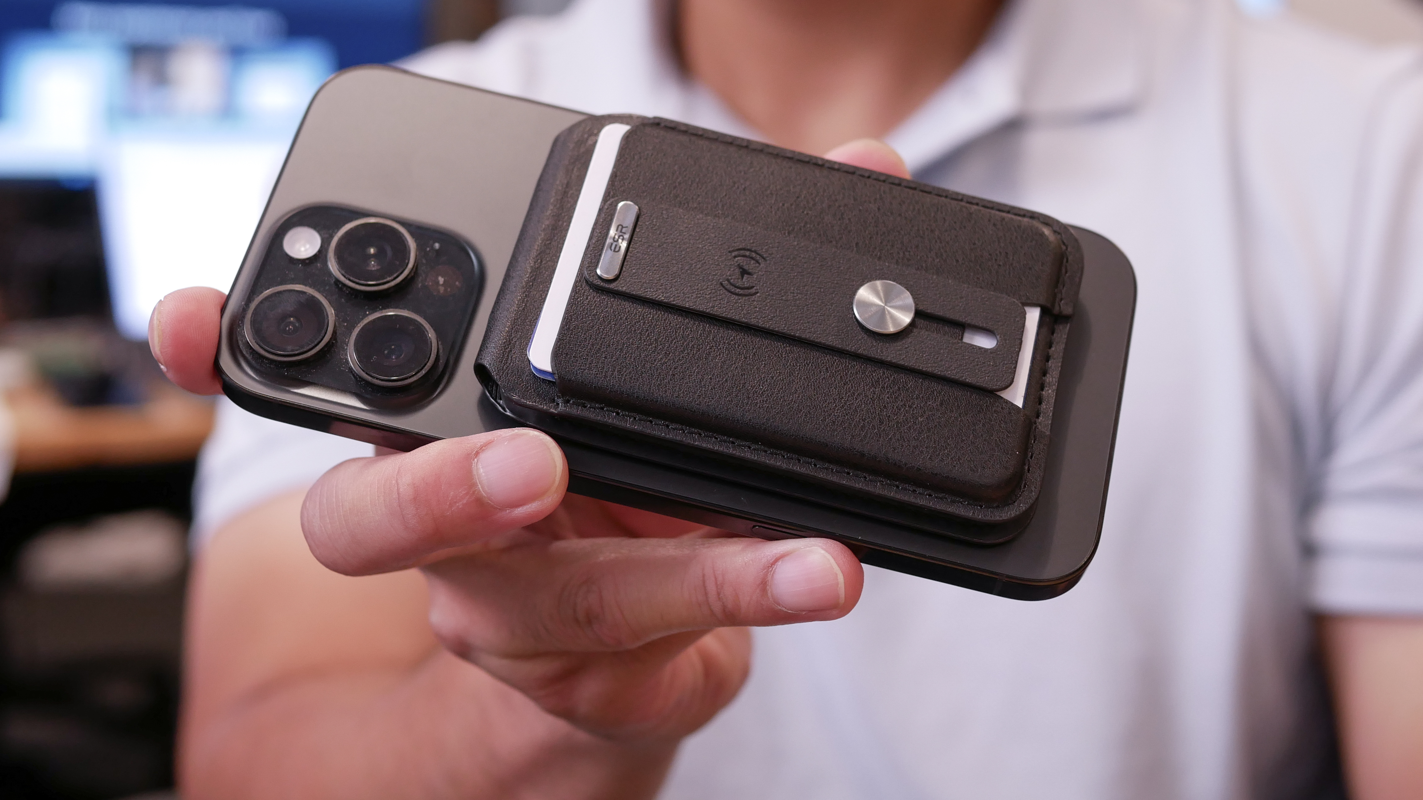 ESR MagSafe Wallet with Find My held in the hand.