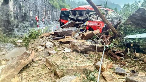 A passenger bus is crushed by a fatal landslide on Khanh Le pass in Khanh Hoa province, Vietnam, Monday, Nov. 17, 2025. (Minh Bang/VNExpress via AP)