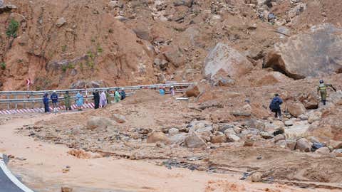 Landslides block the road on Khanh Le pass, near the location where a passenger bus was buried by a fatal landslide in Khanh Hoa, Vietnam, Monday, Nov. 17, 2025. (Bui Toan/VNExpress via AP)