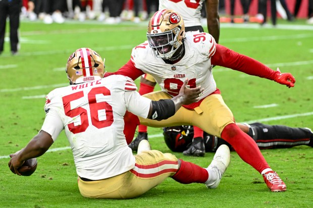Keion White #56 and Sam Okuayinonu #91 of the San Francisco 49ers celebrate a fumble recovery against the Arizona Cardinals during the fourth quarter at State Farm Stadium on Nov. 16, 2025 in Glendale, Arizona. (Photo by Norm Hall/Getty Images)