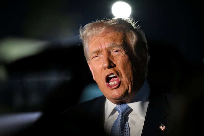 U.S. President Donald Trump speaks to reporters before boarding Air Force One on November 16, 2025 at Palm Beach International Airport in West Palm Beach, Florida.