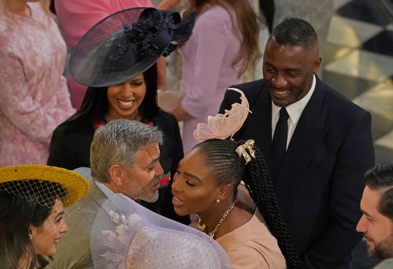 WINDSOR, ENGLAND - MAY 19: George Clooney greets Serena Williams as Idris Elba and Sabrina Dhowre look on at St George's Chapel on May 19, 2018 in Windsor, England. (Photo by Owen Humphreys - WPA Pool/Getty Images)