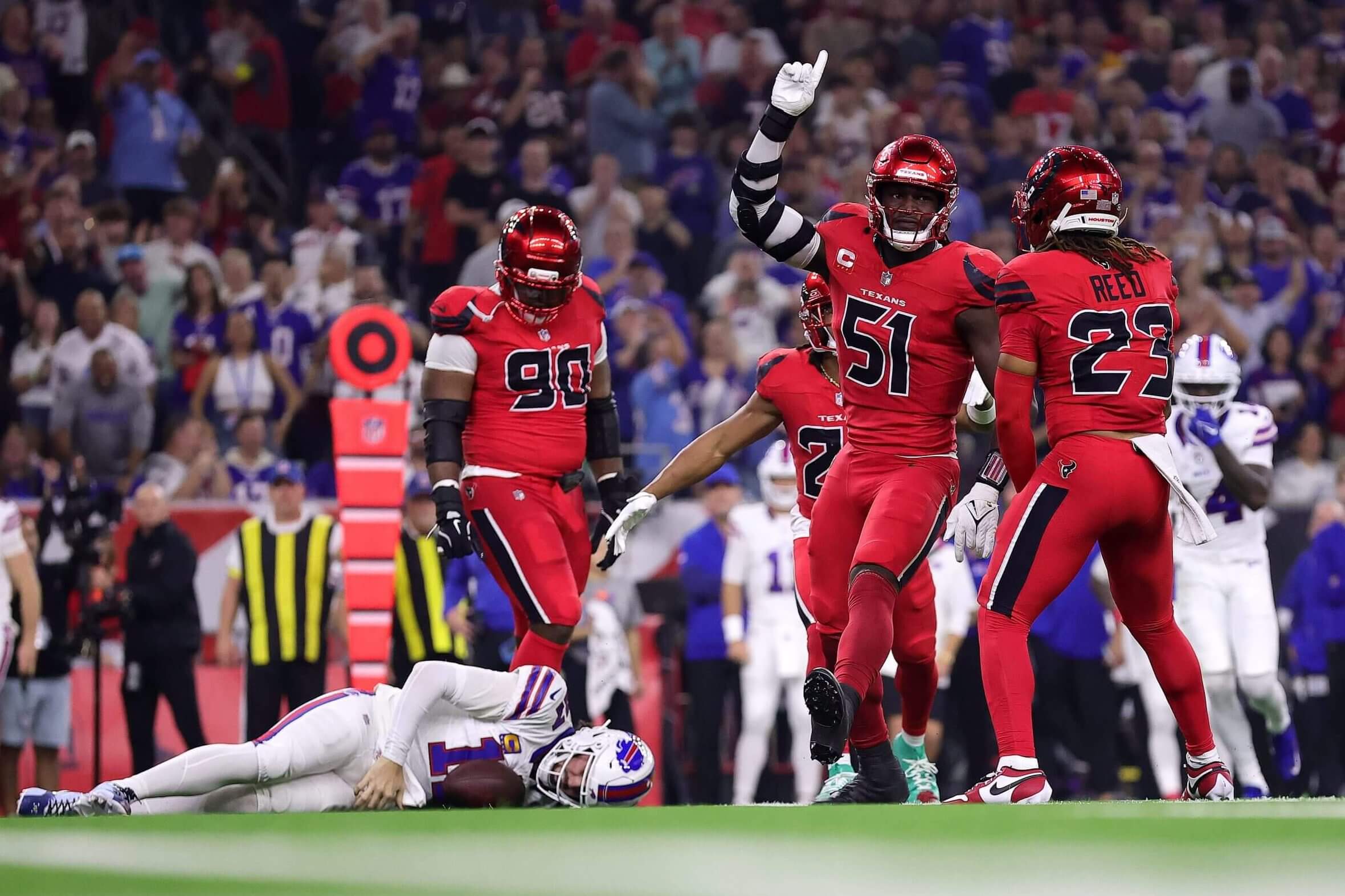 Texans pass rusher Will Anderson celebrates after a sack over fallen Bills quarterback Josh Allen during his team's victory last Thursday in Houston.